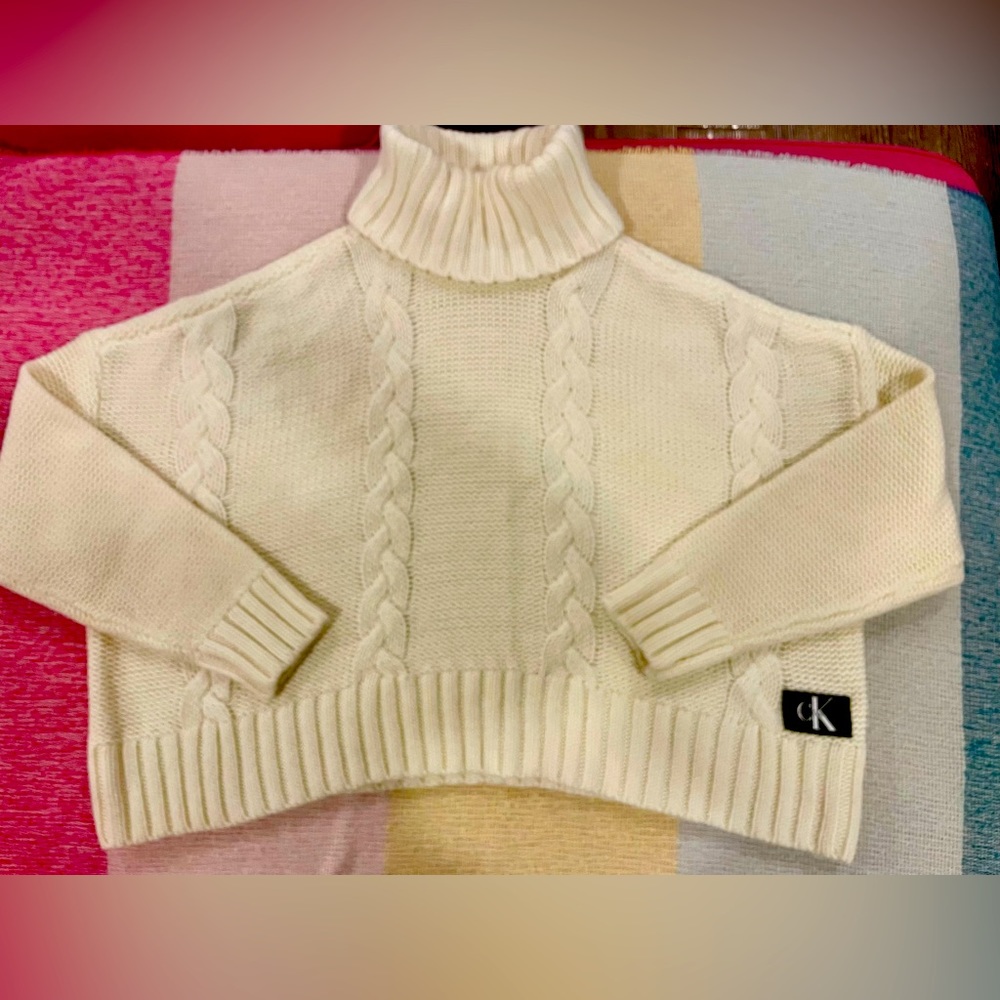 Calvin Klein cream turtleneck oversized sweater.
